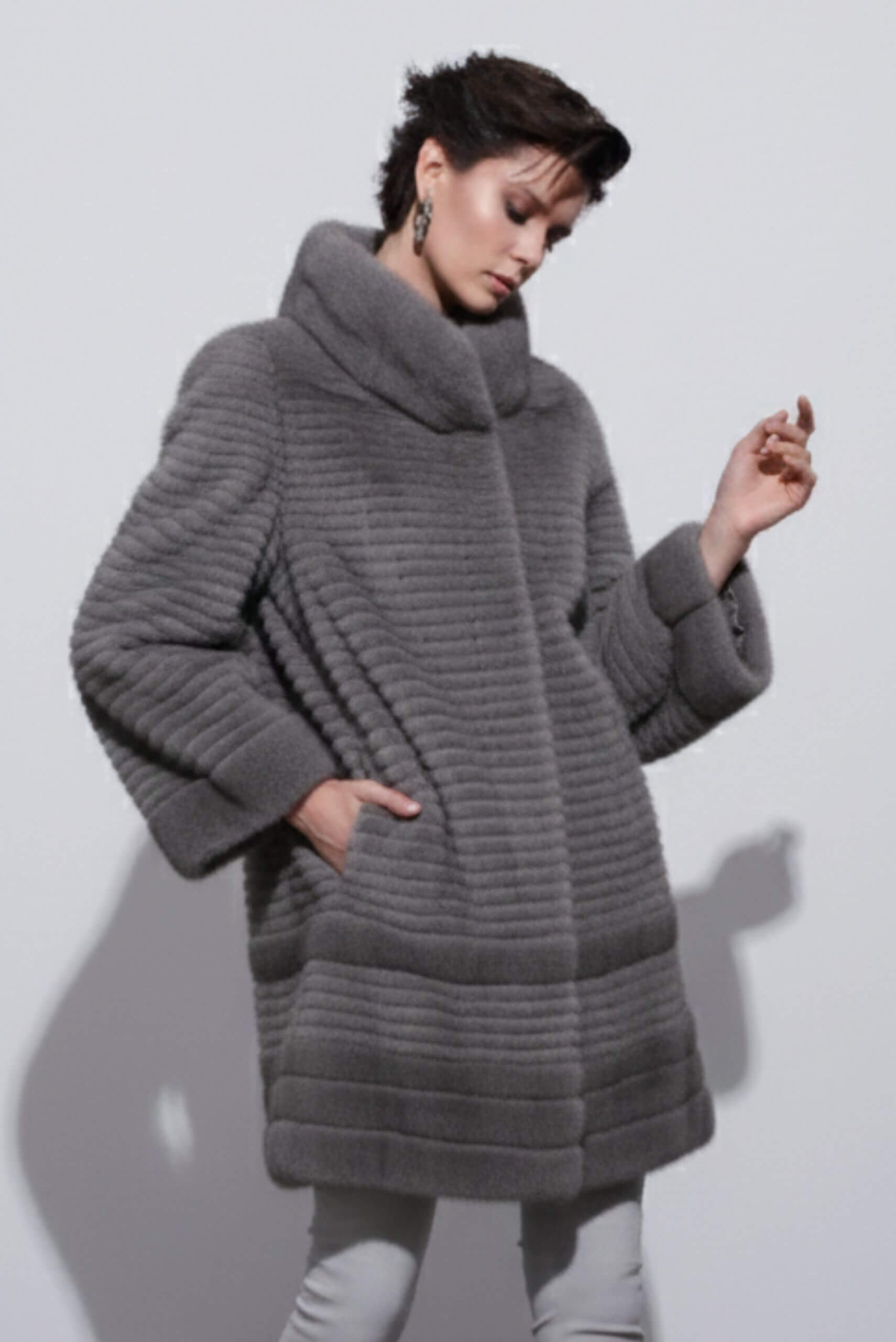 Grey long fur coat showcased in an Istanbul boutique – part of a luxury shopping guide for fur fashion.