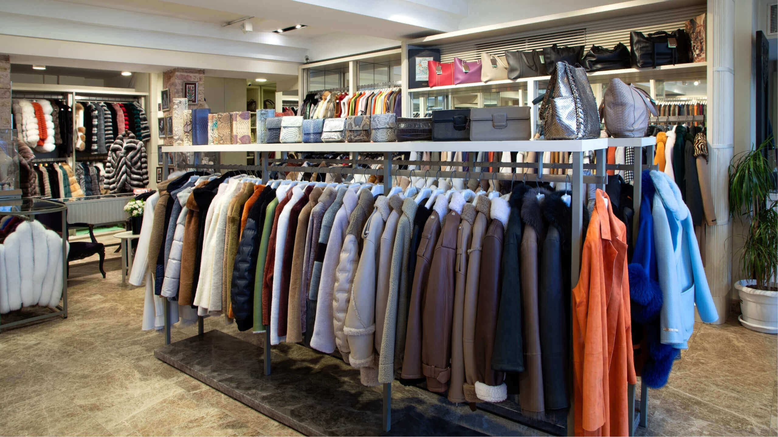 Handmade leather jackets and luxury fur coats displayed at Koç Leather & Fur boutique. Premium Turkish leather craftsmanship and high-end fashion collection."